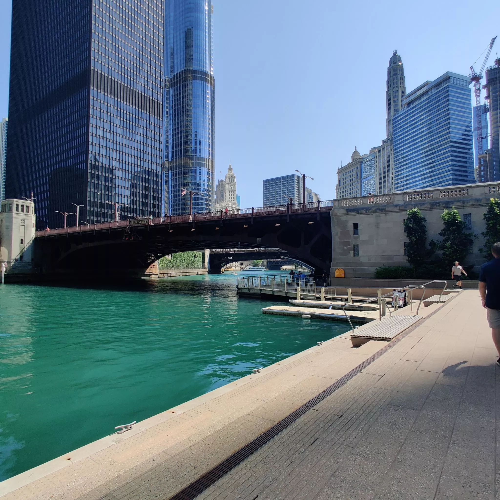 View along the Riverwalk of 
bridge and neighboring skyline.